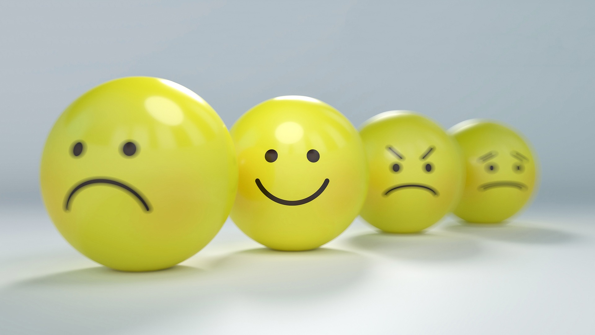 yellow balls with different faces on them