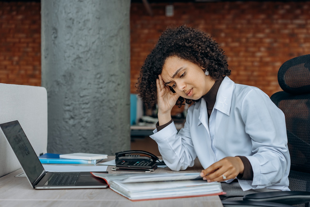 stressed female employee at desk