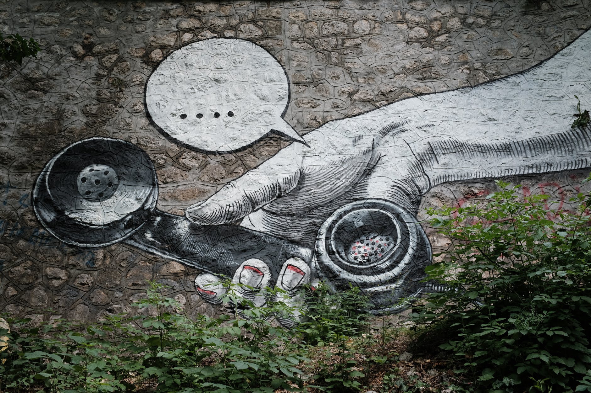 street art painting or retro telephone and empty speech bubble