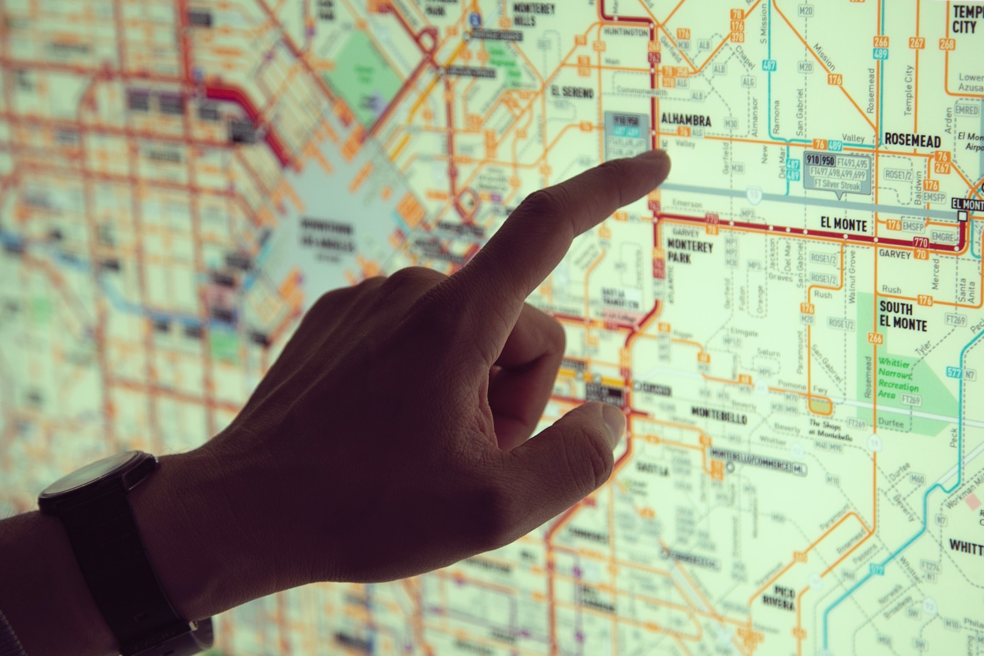 hand pointing to map